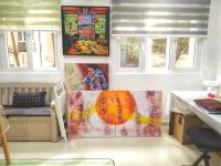 Whimsical uplifting art painting of bright orange sun imagery, abstract expressionist original artwork with calligraphy lines and etchings