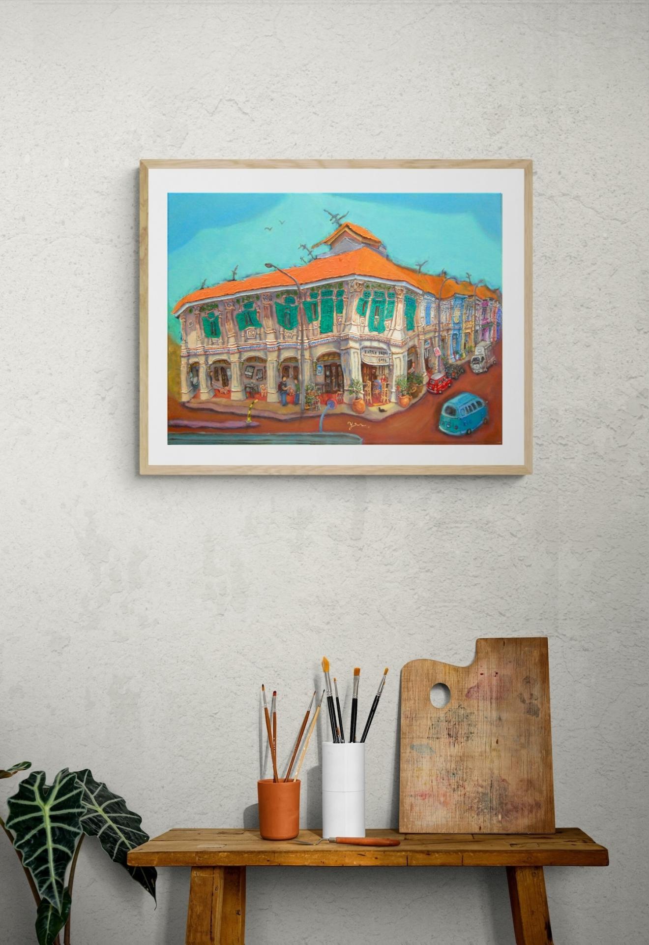 Blair Road conservation shophouse art shown as framed in a rustic desk setting