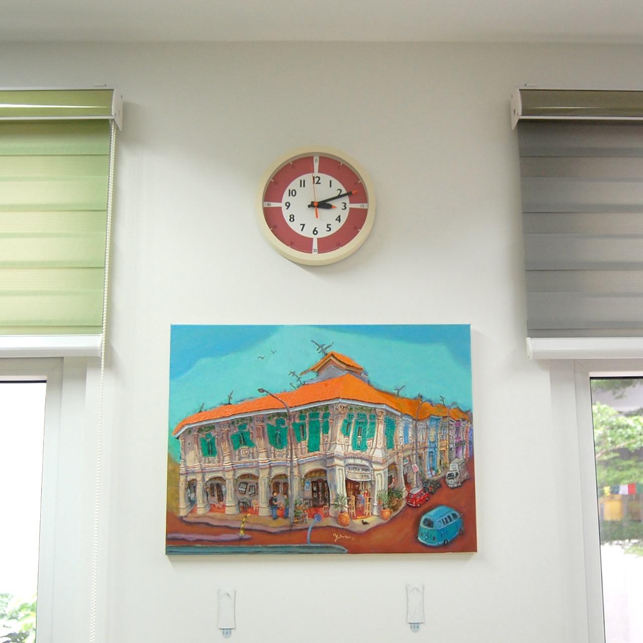 18x24 inch shophouse architectural art Blair Road Corner hung below a clock