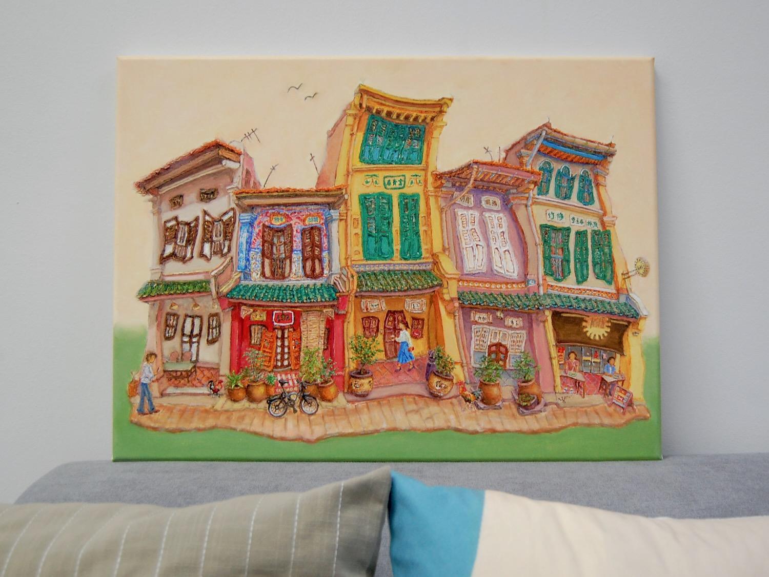 Original Singapore heritage painting Spottiswoode Park Shophouses on a sofa for size reference